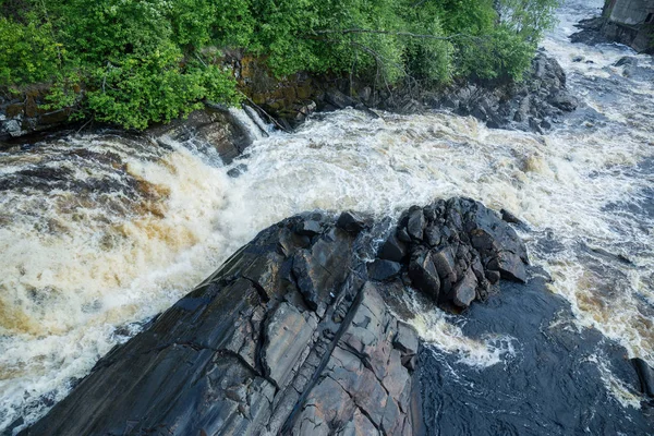 picturesque landscape with waterfall in forest of Karelia, Russia