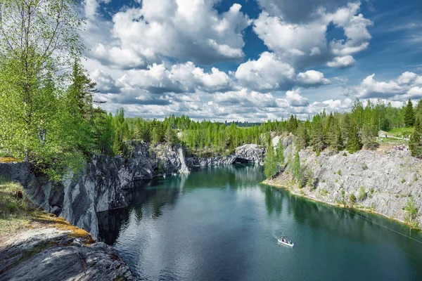 Marble quarry with boat in middle in Ruskeala Park in Republic of Karelia, Russia — Stock Image Marble Quarry Boat Middle Ruskeala Park Republic Karelia Russia Royalty Free Stock Photos