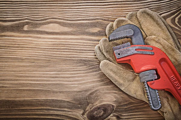 Gloves and monkey wrench — Stock Photo, Image