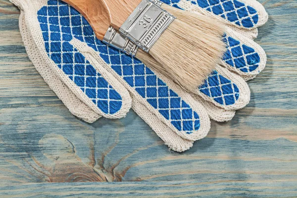 Paintbrushes and protective gloves — Stock Photo, Image