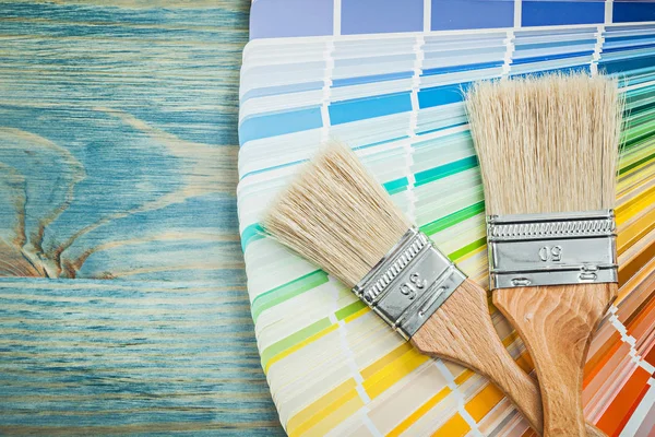 Color sampler and paint brushes — Stock Photo, Image