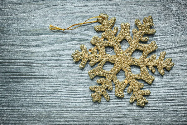 Christmas snowflake decoration on wooden board — Stock Photo, Image