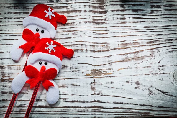 Two snowmen in red Santa hat — Stock Photo, Image