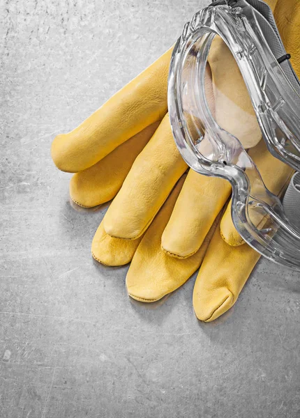 Protective glasses and construction gloves — Stock Photo, Image