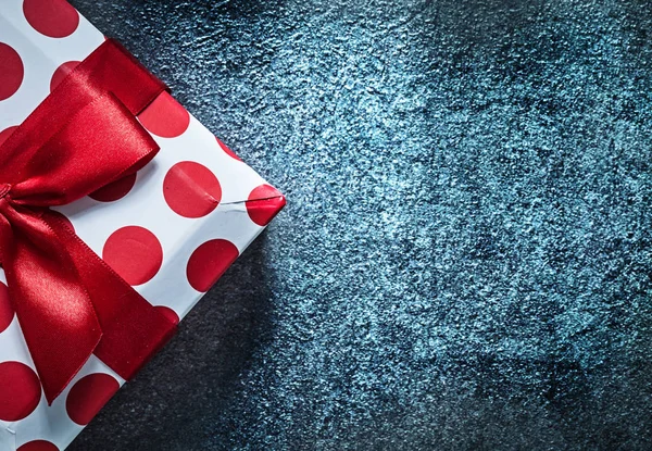 Red gift box on black background holidays concept — Stock Photo, Image