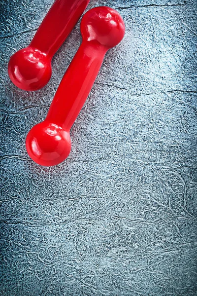 Dumbbell weights on silver surface sports training concept — Stock Photo, Image