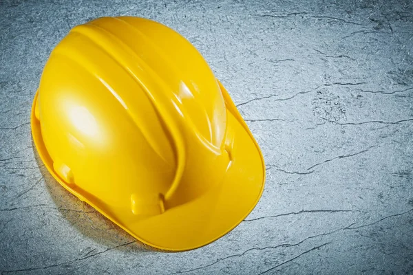 Building helmet on metallic surface construction concept — Stock Photo, Image