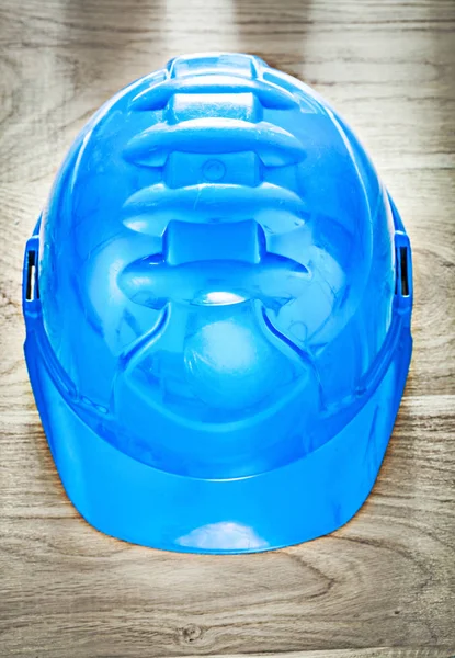 Protective building helmet on wooden board construction concept — Stock Photo, Image