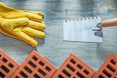 Kırmızı tuğla Emanet eldiven örmek mala kavram bina