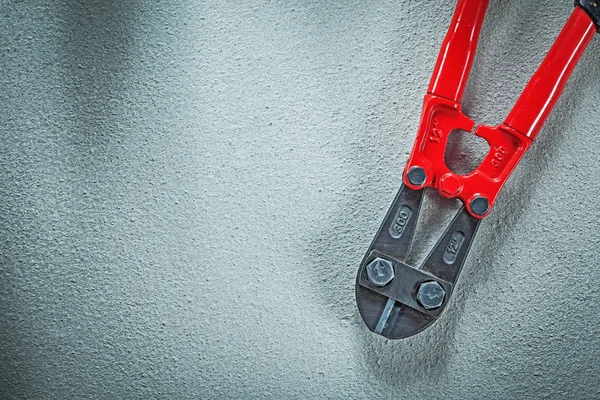 Steel cutter on concrete background construction concept — Stock Photo, Image