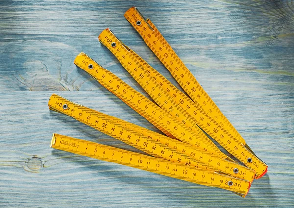 Wooden meter on vintage wood board directly above construction c — Stock Photo, Image