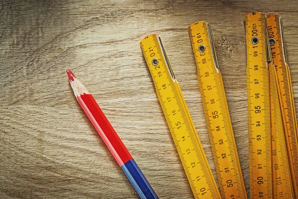 Wooden meter pencil on wood board construction concept — Stock Photo, Image