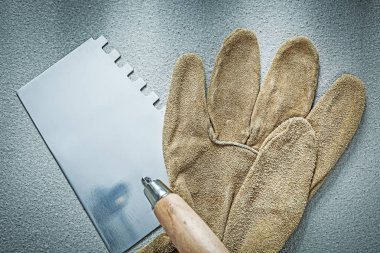 Örmek mala çalışma eldivenleri beton arka plan Tec.