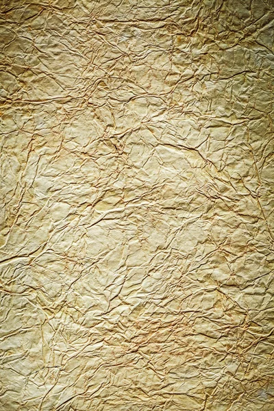 Ancient crumpled paper on grey background close up view — Stock Photo, Image