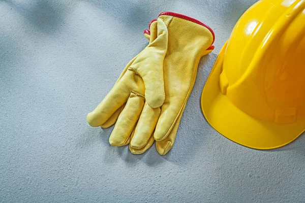 Safety cap protective gloves on concrete surface construction co — Stock Photo, Image