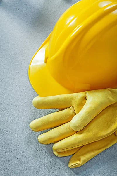 Building helmet protective gloves on concrete surface constructi — Stock Photo, Image