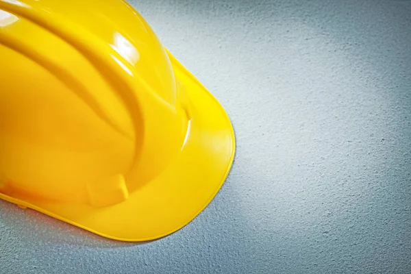 Protective hard hat on concrete background construction concept — Stock Photo, Image