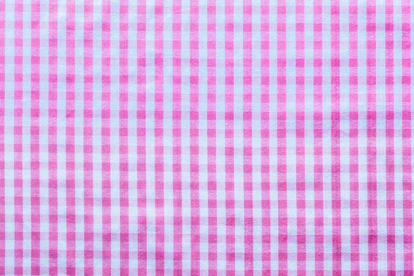 Rózsaszín kockás pamut háttér felülnézet — Stock Fotó