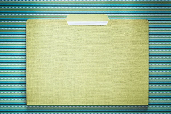 Cardboard office folder on stripy background directly above — Stock Photo, Image