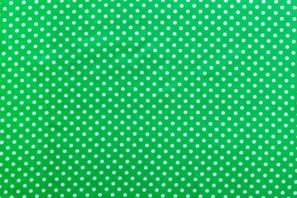 녹색 폴카 도트 목화 배경 바로 위에 — 스톡 사진
