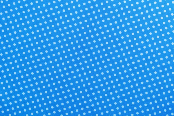 Blaues gepunktetes Baumwoll-Tischtuch direkt darüber — Stockfoto