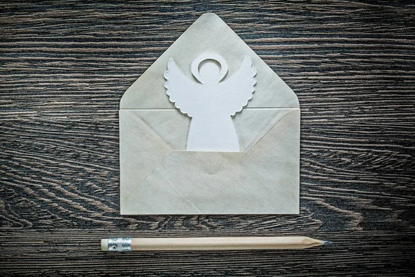 Vintage envelope angel pencil on black board — Stock Photo, Image