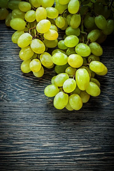 Sweet grapes on wooden board — Stock Photo, Image