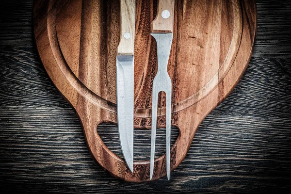 Set of meat fork knife carving board on vintage wooden backgroun — Stock Photo, Image