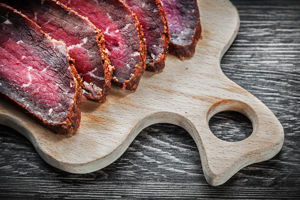 Sliced meat carving board food concept