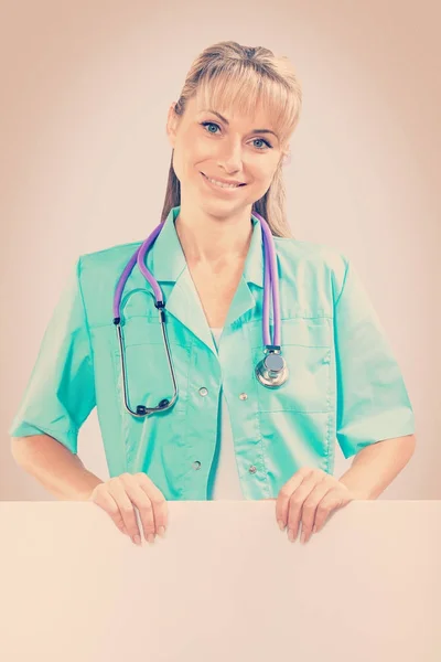 Color stilised female doctor with white placard — Stock Photo, Image