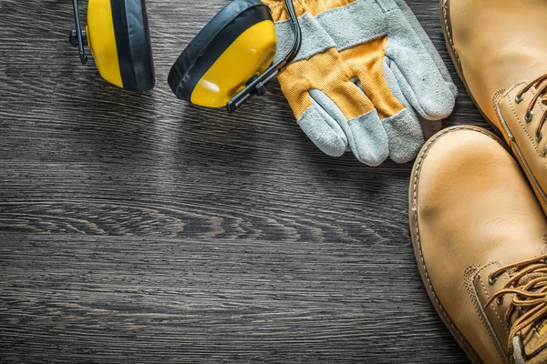Composition of safety workwear on wooden board — Stock Photo, Image