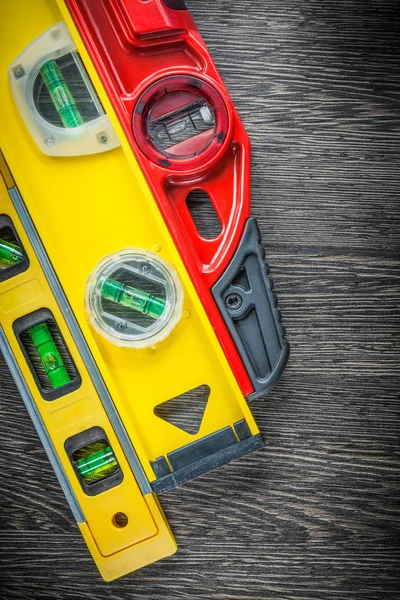 Set of construction levels on wooden board — Stock Photo, Image