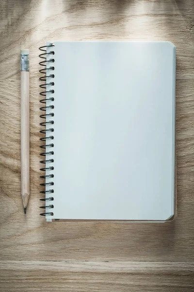 Opened notebook pencil on wooden board — Stock Photo, Image