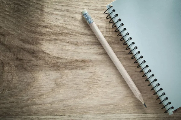 Notepad pencil on wooden board office concept — Stock Photo, Image