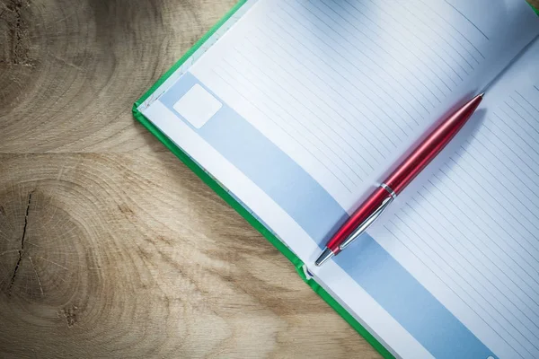 Opened notebook ballpoint pen top view — Stock Photo, Image