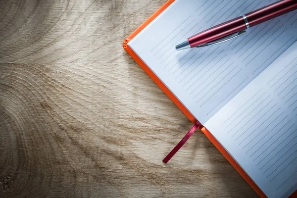 Opened notebook pen top view — Stock Photo, Image