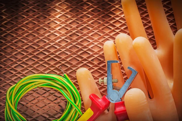 Insulation strippers rolled electrical wire electricians gloves — Stock Photo, Image