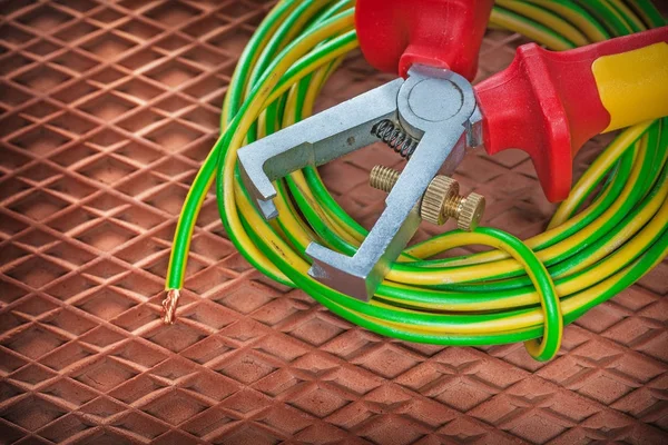 Insulation strippers electric wire on dielectric mat — Stock Photo, Image