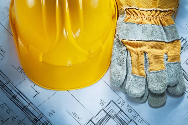 Hard hat safety gloves on construction drawing — Stock Photo, Image