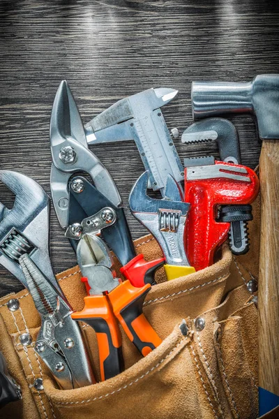 Set of leather building belt with construction tooling on wooden — Stock Photo, Image