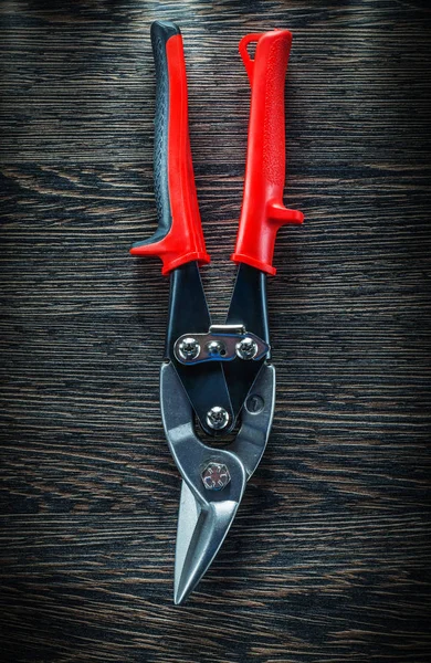 Sharp steel cutter on wooden board — Stock Photo, Image