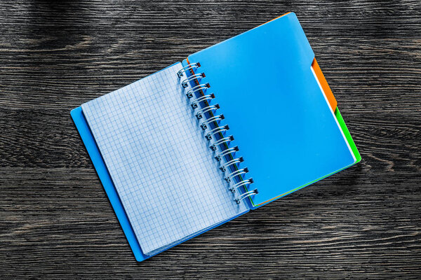 Checked notebook on vintage wooden board