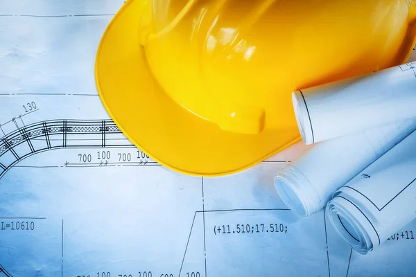Safety building helmet construction plans on blueprint — Stock Photo, Image