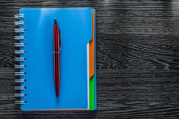 Biro pen notebook on vintage wooden board