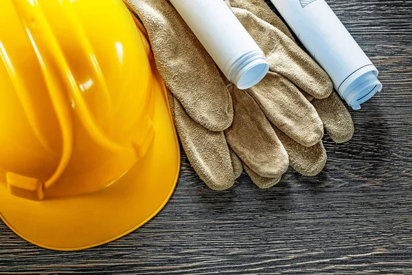 Leather protective gloves construction plans hard hat on wooden — Stock Photo, Image