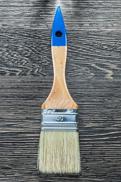 Brush for painting on wooden board top view — Stock Photo, Image