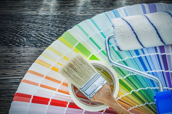 Paint brushes roller color pantone fan household tape on wood bo — Stock Photo, Image