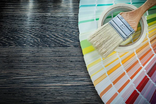 Paint brush color pantone fan adhesive tape on wood board — Stock Photo, Image
