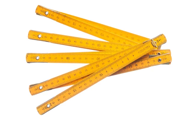 Medidor de madeira de medição isolado em branco — Fotografia de Stock