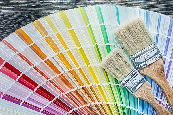 Color pantone fan paintbrushes on wooden board — Stock Photo, Image